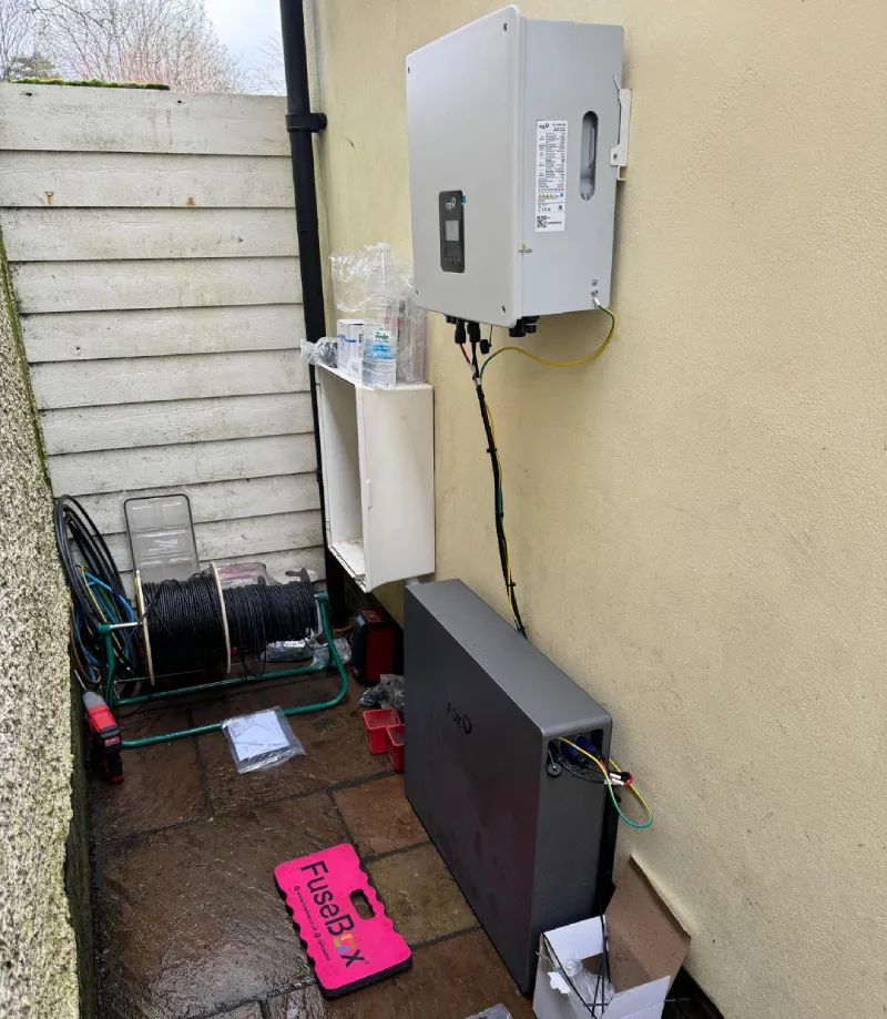 Outdoor electrical installation with cables and tools.