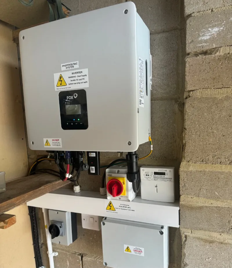 Photovoltaic solar energy inverter on brick wall